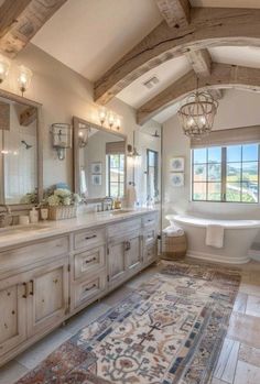 a large bathroom with an ornate rug on the floor and chandelier hanging from the ceiling