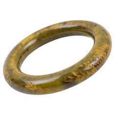 This amazing asparagus green and black marble Bakelite bracelet bangle has a chunky, rounded domed shape with deep floral carving all around it. The piece boasts an intense light asparagus green marble color with black and yellow cloudy swirling. Measurements: Inside across is 2.50 in diameter (6.3 cm) - outside across is 3.63 in diameter (9.2 cm) - width is 0.57 in (1.4 cm) - the wall is 0.57 in (1.4 cm). The inner circumference of the bracelet is 7.79 in (19.46 cm). Feel free to double-check t 1960s Costume, Bakelite Bracelets, Marble Jewelry, Marble Colors, Green Marble, Old Jewelry, Bracelet Bangle, Green And Black, Black Marble