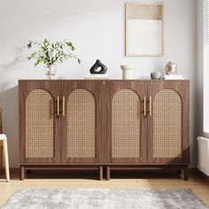 a living room with a rug, chair and sideboard