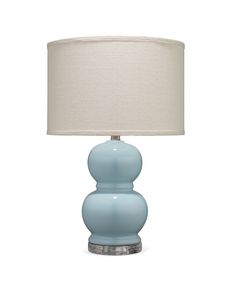 a blue table lamp with a white shade