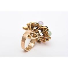 This is part of Chairish’s Fine Jewelry assortment.  This ever so chic vintage 1960's 14K Gold cluster dome cocktail ring or everyday ring has various round stones in interspersed jade, amethyst, coral and black and white onyx. The gold spiral forms are of raised height. it is a size 7 and can be sized to fit you at your end. This is a forever ring with great dimension. It could go everyday day to evening wear. PLEASE NOTE: WE ARE ONLY ABLE AND WILLING TO DO ONE MARKDOWN AND THIS IS THE FINALE PRICE NOW.  Dimensions reference the ring size and are not specific to the ring itself. Elegant Cabochon Cluster Ring For Anniversary, Vintage Pearl Ring With Gemstone, Vintage Gold Multi-stone Cluster Ring, Vintage Multi-stone Pearl Ring For Anniversary, Elegant Oval Multi-stone Dome Ring, Vintage Multi-stone Pearl Ring For Formal Occasions, Vintage Multi-stone Pearl Ring For Formal Events, Retro 14k Gold Rings For Formal Occasions, Retro 14k Gold Formal Rings