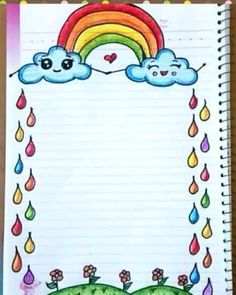 an open notebook with a drawing of a rainbow and clouds on the page, which has rain drops falling from it