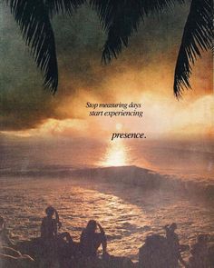 an advertisement with people sitting on the beach watching the sun go down over the ocean