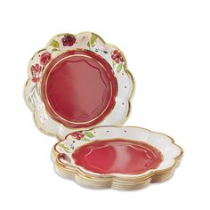 red and white plates with gold rims are set next to each other on a white background