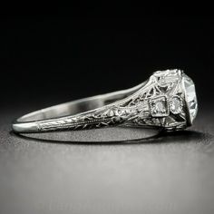 an antique diamond ring with filigree details