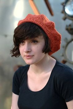 a woman wearing a red knitted hat