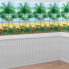 an empty room with palm trees and flowers on the wall