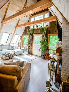 a living room filled with furniture and lots of windows