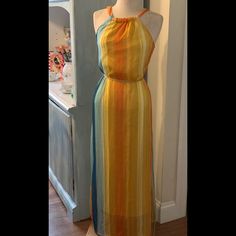 Nwt Colorful Striped Chiffon Dress , Lined. Tie Around Waist Adorable Key Hole Halter In Back. 54 Inches From Top Of Dress To Bottom Hem And Measures Under Armpit Across To Other Armpit 17 Inches. Adorable Summer Maxi Dress Multicolor Fitted Chiffon Beach Dress, Fitted Multicolor Chiffon Beach Dress, Flowy Yellow Chiffon Beach Dress, Yellow Chiffon Beach Dress, Yellow Flowy Sleeveless Chiffon Dress, Flowy Sleeveless Yellow Chiffon Dress, Yellow Sleeveless Chiffon Dress For Spring, Halter Top Maxi Dress, Ivory Maxi Dress