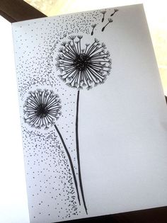 an image of a dandelion drawing on paper