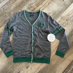 Brand New With Tags. Size Small Harry Potter Slytherin Cardigan From Wizarding World Of Harry Potter. Slytherin Cardigan, Harry Potter Sweater, Harry Potter Slytherin, Wizarding World Of Harry Potter, Wizarding World, Warner Bros, Green And Grey, Sweaters & Cardigans, Cardigans