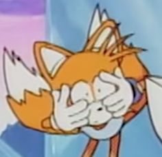 an orange and white cartoon character with his eyes closed