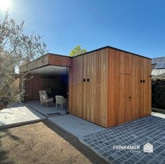 a small wooden building sitting on top of a patio