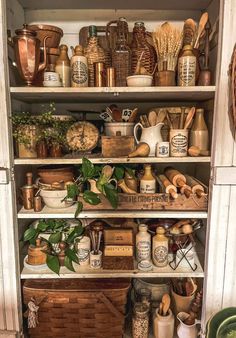 an open cabinet filled with lots of different items