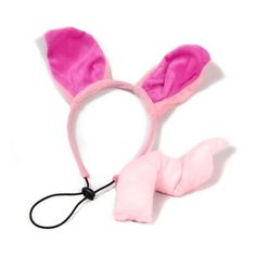 a pink bunny ears and tail on a headband with a black cord attached to it