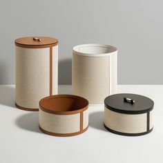 three different types of canisters sitting on a table