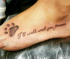 a foot with a tattoo saying i'll walk with you forever