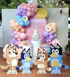 an image of a birthday party with cake and balloons in the shape of cartoon characters