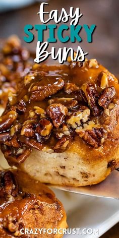 sticky buns with pecans and caramel drizzled on the top