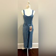 Jean Jumpsuit. Nwt. Never Worn. 100% Cotton. Zipper On Side. Fitted Washed Blue Jumpsuits And Rompers With Pockets, Summer Washed Blue Fitted Jumpsuits And Rompers, Fitted Washed Blue Jumpsuits And Rompers For Summer, Fitted Washed Blue Overalls, Blue Cotton Overalls For Loungewear, Fitted Overalls With Pockets For Loungewear, Fitted Cotton Overalls In Washed Blue, Blue Fitted Cotton Jumpsuits And Rompers, Fitted Blue Cotton Jumpsuits And Rompers