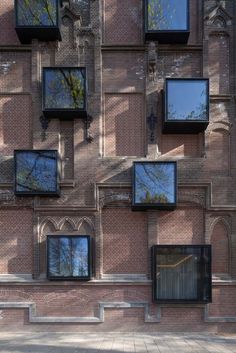 the building has many windows on each side and one window is in front of it