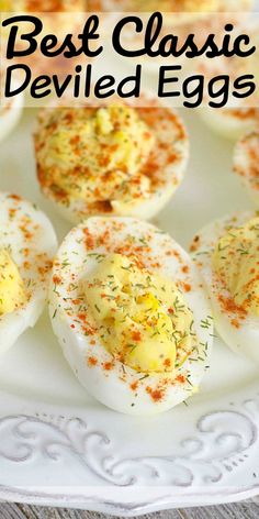 deviled eggs on a plate with sprinkles and seasoning in them