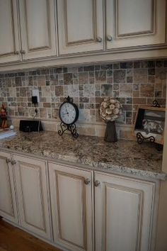 a kitchen counter with a clock and other items on it's side, in the middle of an instagram