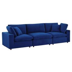 a blue couch with pillows on it