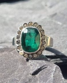 A fine quality Sterling silver Victorian dress ring with paste set gems simulating a large central Emerald with a rich hue  surrounded by diamonds. This eye-catching ring is unmarked but has been professionally tested and is in excellent condition. This ring is sizable SIZE - US 6 UK L   GEM DIMENSIONS - 10mm x 8mm WEIGHT - 4.0 Grams Any questions please feel free to ask. Complimentary shipping included in the price Sterling Silver Cross Pendant, Silver Cross Pendant, Ring Emerald, Silver Lockets, Dress Rings, Sterling Silver Cross, Silver Cross, 925 Silver Rings, Rings Statement