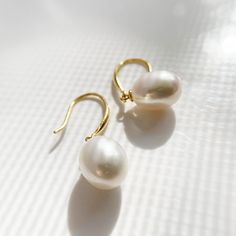 "Material:100% 925 Sterling Silver with 14K Gold Plated Main stone: Cultured Fresh Water Pearl Gemstone Other stone: N/A Weight (Pair):3.2g Size: 30mm x 10mm / 1.18\" x 0.39\" Condition:New Main color:Gold Quantity:2 pcs Pearl color:White Pearl shape: Ellipsoid Pearl luster: Very High Pearl blemish: 90% free Pearl grade:AA+ This vintage drop earings are made with 12mm Cultured Freshwater Pearl stone and solid 925 sterling silver w/ 14K gold plating for better quality and prolonged shine! *It com Classic High Luster Drop Pearl Earrings, Everyday Pearl Drop Earrings, Fine Jewelry, Akoya Pearl Drop Earrings With Ear Wire, Gold Briolette Pearl Earrings With High Luster, Teardrop 14k Gold-filled Pearl Earrings For Anniversary, 14k Gold Filled Teardrop Pearl Earrings For Anniversary, Teardrop 14k Gold Filled Pearl Earrings For Anniversary, 14k Gold Teardrop Pearl Earrings For Pierced Ears, 14k Gold Teardrop Pearl Earrings