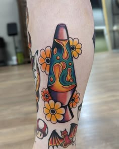 a colorful tattoo on the leg of a woman