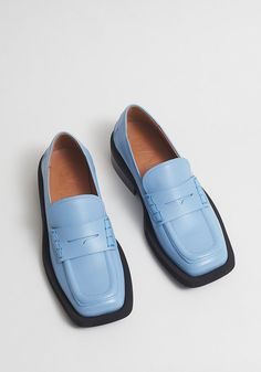 Classic loafers in a creamy blue matte leather with a square toe, wide ribber welts and low block heel. Subtle Ganni logo at back ankle. Comes in full sizes only. 100% leather upper with stacked heels Made in Spain Leather Square Toe Platform Loafers For Spring, Spring Square Toe Leather Platform Loafers, Square Toe Platform Loafers For Business In Spring, Spring Loafers With Branded Insole And Square Toe, Ethical Shoes, Classic Loafers, Four Horsemen, Tiny Cottons, Mini Rodini