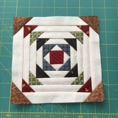 a close up of a piece of fabric on a cutting board