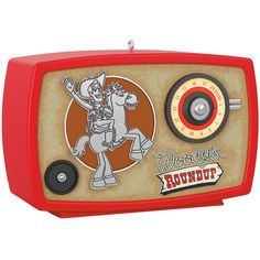 an old fashioned radio with a cartoon character on the front and side panel, sitting on a white background