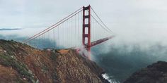 an aerial view of the golden gate bridge in san francisco, california on a foggy day