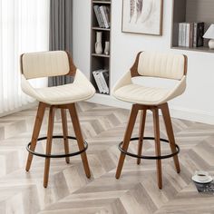 two white bar stools in a living room