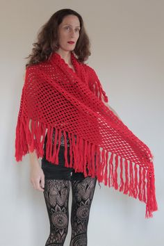 Light up the winter with this super vibrant red hand crochet fringe scarf! I love color in the winter and this red almost glows. Lovely hand crochet pattern with a triangular shape and long fringe. Use this in the winter and summer as well for when the temperature drops at night. Super fun to wear at a festival and channel your inner Stevie Nicks. The yarn is soft and not itchy to my skin. I think that it is a wool poly mix. No labels, made by a very talented knitter. Very good vintage condition Bohemian Red Scarves For Festivals, Red Bohemian Shawl For Winter, Red Bohemian Shawl With Motifs, Red Handmade Bohemian Shawl, Red Bohemian Shawl With Fringe, Kids Maxi, Crochet Fringe, Boho Scarfs, Crochet Wool