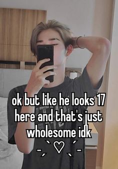 a man taking a selfie with his phone in front of him and the caption says, ok but like he looks 17 here and that's just wholesome idk