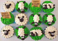 cupcakes made to look like sheep with happy birthday signs on them and grass