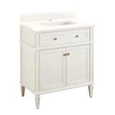 a white bathroom vanity with two drawers and a single sink in the center, against a white background