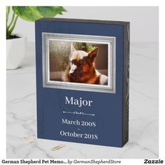 a memorial book with a photo of a german shepherd dog on it and the words major