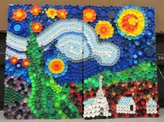 a large piece of art made out of bottle caps with flowers and clouds painted on it