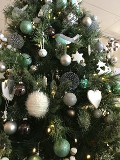 a decorated christmas tree with ornaments and lights