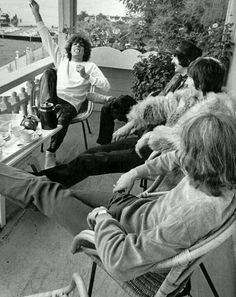 an old photo of a man speaking to a group of people in front of him