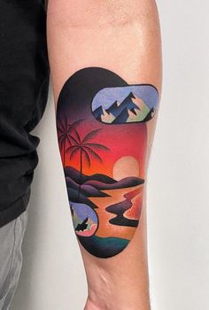 a man with a tattoo on his arm that has mountains and palm trees in the background