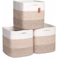 three white and beige baskets stacked on top of each other