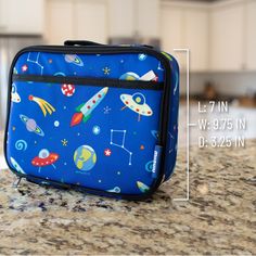 100% play-proof and perfect for elementary school age, Wildkin's classic square shaped lunch box is designed to help you and the environment by offering a fun and reusable option for lunch and snack time. Apart from the roomy main compartment, this lunch box features a zippered front pocket that is perfect for hiding a surprise treat or securing sweet notes. The lunch box also features an interior mesh pocket for storing napkins, utensils or an ice pack. Sized just right for kids and adults, the Playful Blue Lunch Box Gift, Portable Lunch Box For Travel And Back To School, Portable Rectangular Lunch Bag For Back To School, Rectangular Portable Lunch Bag For Back To School, Playful Rectangular Lunch Bag For Back To School, Multicolor Rectangular Lunch Bag, Blue Portable School Lunch Box, Functional Blue Lunch Box For School, Playful Rectangular Lunch Bag For Playtime