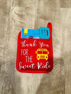 a red bib with the words thank you for the sweet ride written on it