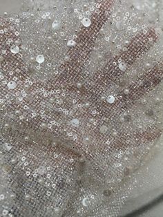 Note: The sequins,beads, pearls in the fabric are very firm. Slight glitter in the background fabric will fall off! 2 Styles Sequins(3mm sequins & 5MM sequins) and 2 style beads(big Pearls and Mini sliver beads) Were embroidery in the super shiny glitter fabric. Real item is super shiny and gorgeous than the pictures. Width: About 125cm Quantity: This listing is for 1 yard. You will get uncut piece,if you buy more than 1 yard. Feature: 2 Styles beads,2 Styles sequins were embroidered in the White Glamorous Sequin Fabric With Rhinestones, Glamorous White Sequin Fabric With Rhinestones, White Embellished Sequin Fabric For Parties, White Beaded Sequin Fabric For Party, White Beaded Sequin Fabric For Evening, Silver Beaded Sequin Fabric For Party, Silver Sequin Fabric With Pearl Embroidery For Party, White Lace Fabric, Bridal Dresses Lace