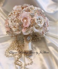 a bridal bouquet with pearls and roses